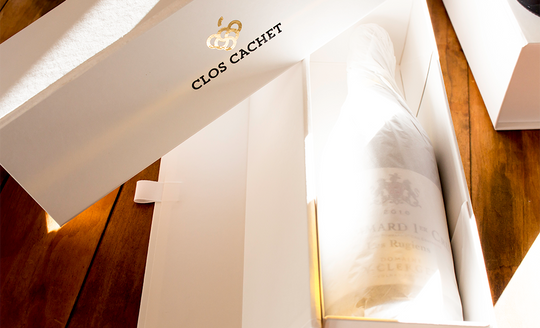 Bottle of Yvon Clerget wine wrapped up in tissue paper within the gift box